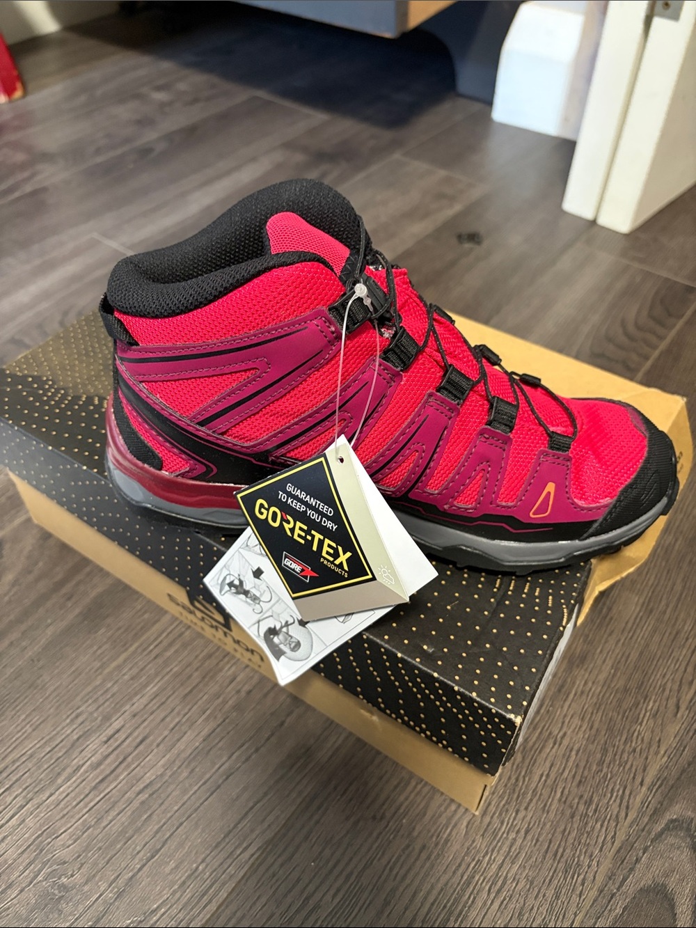 Salomon Kids' Mid-Top Hiking Boots in Bright Pink and Black
